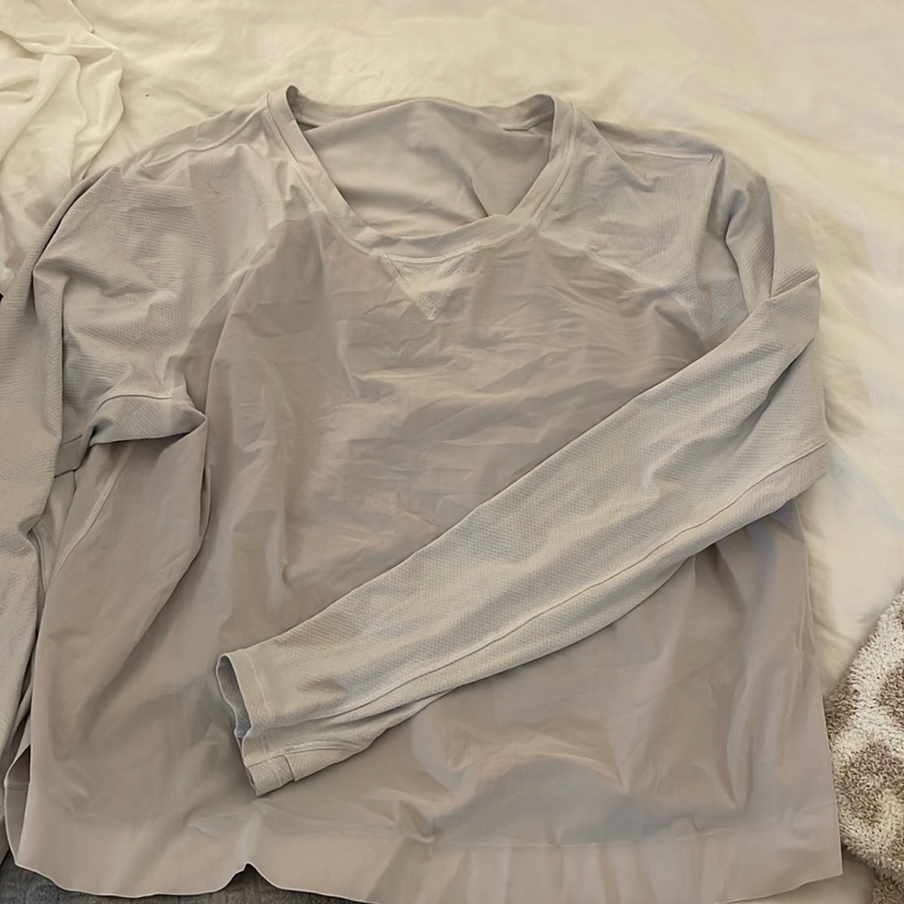 White tastefully cropped long sleeve lululemon top